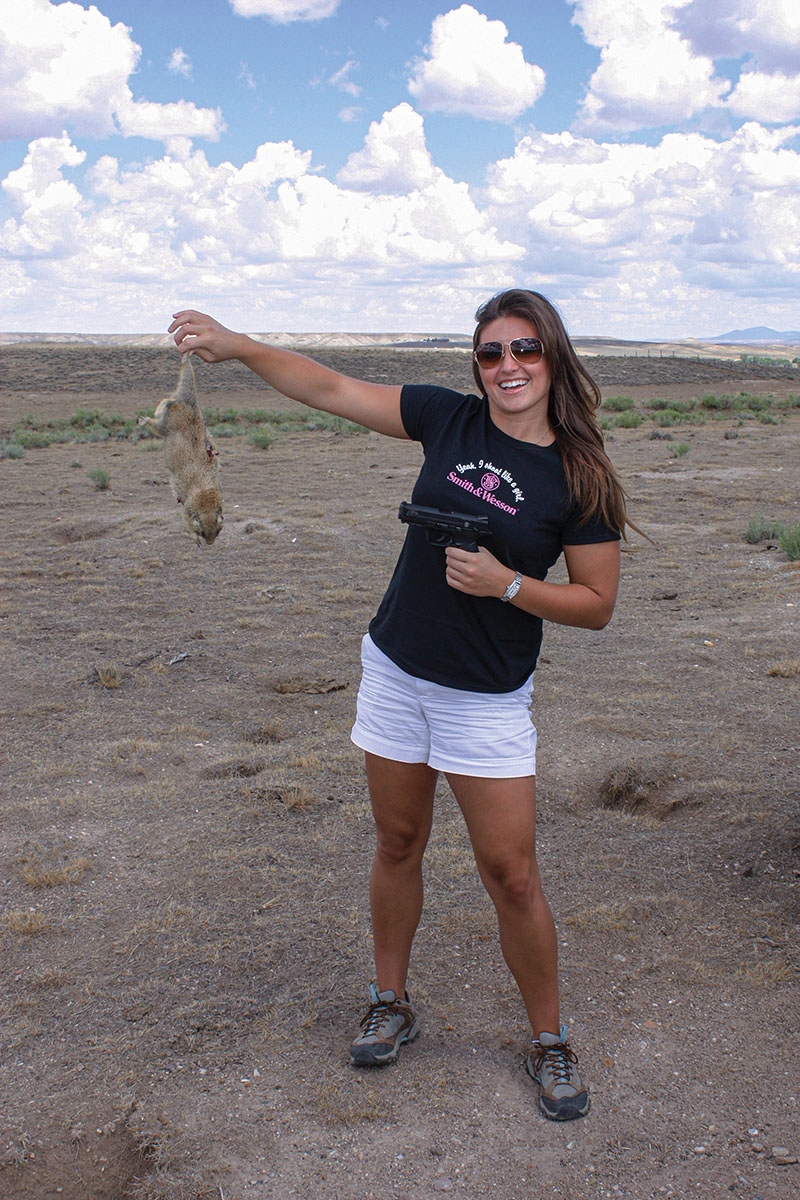 The “camp cook” demonstrated her skills with an iron-sighted S&W M&P pistol chambered in 22LR. Her smile says it all!